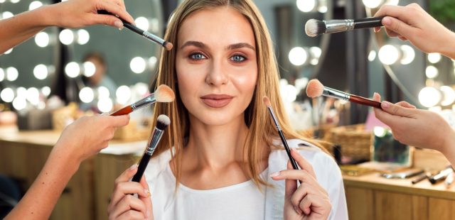 women-holding-make-up-brushes